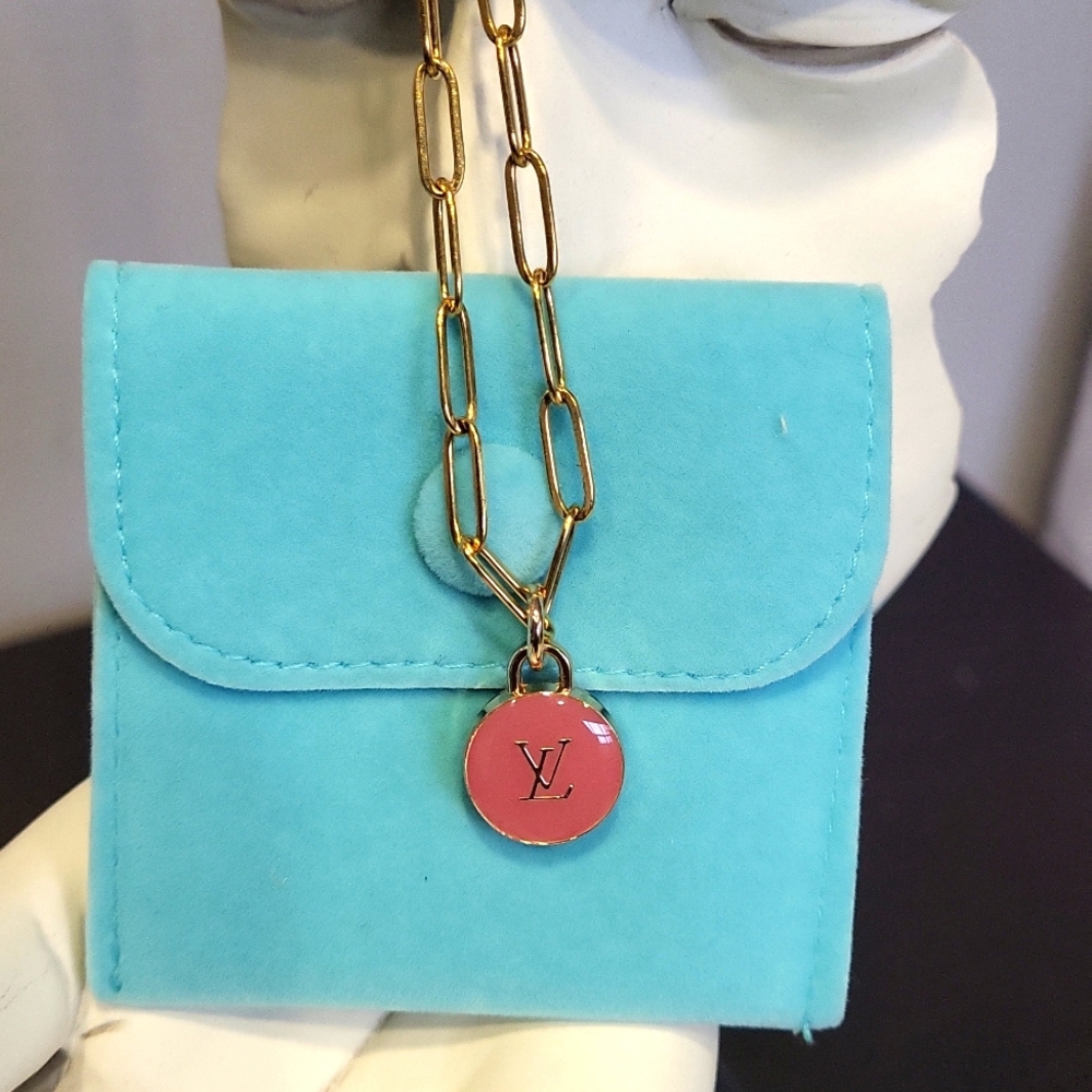 Luxury necklace with a repurposed LV bag charm